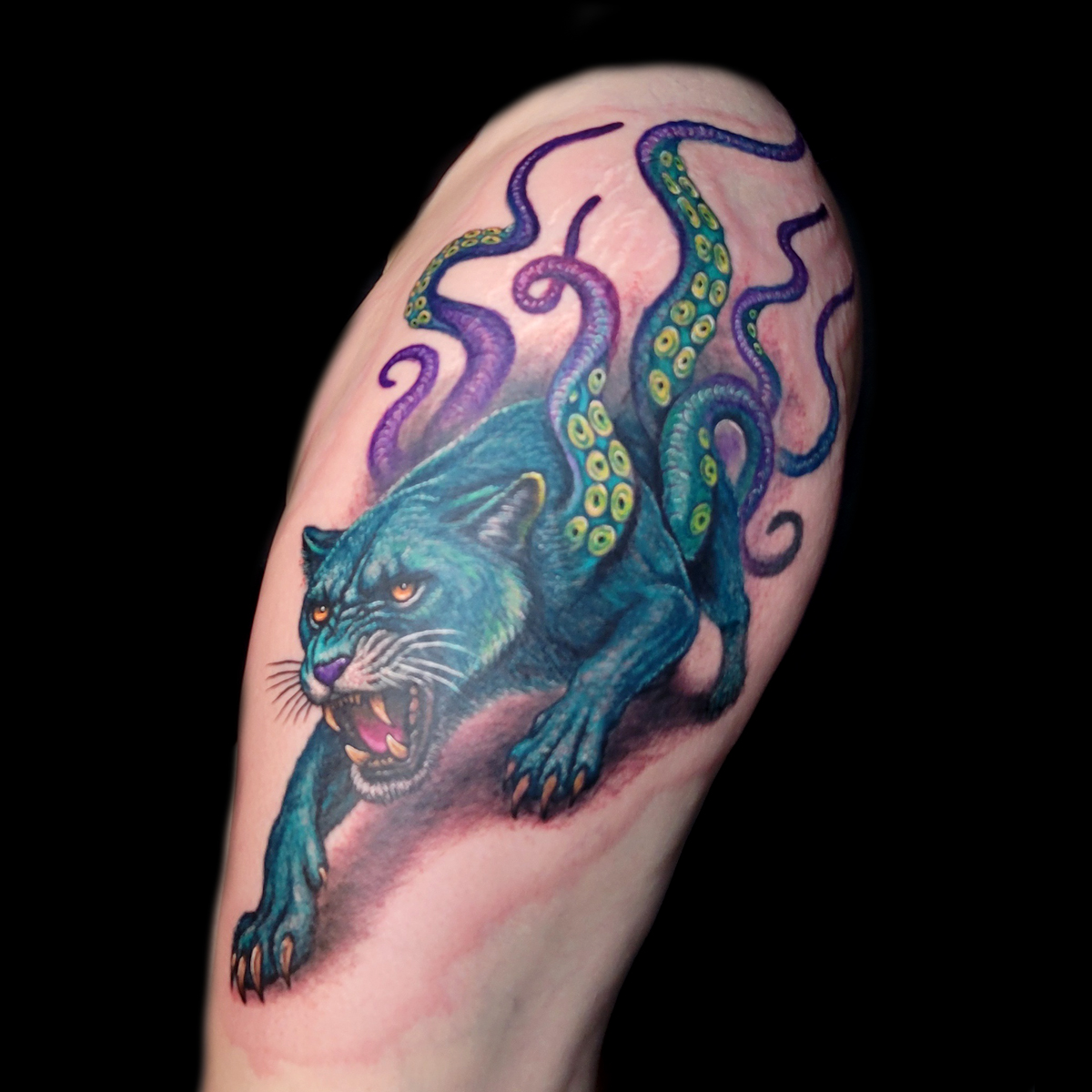 color realistic lioness tentacles tattoo